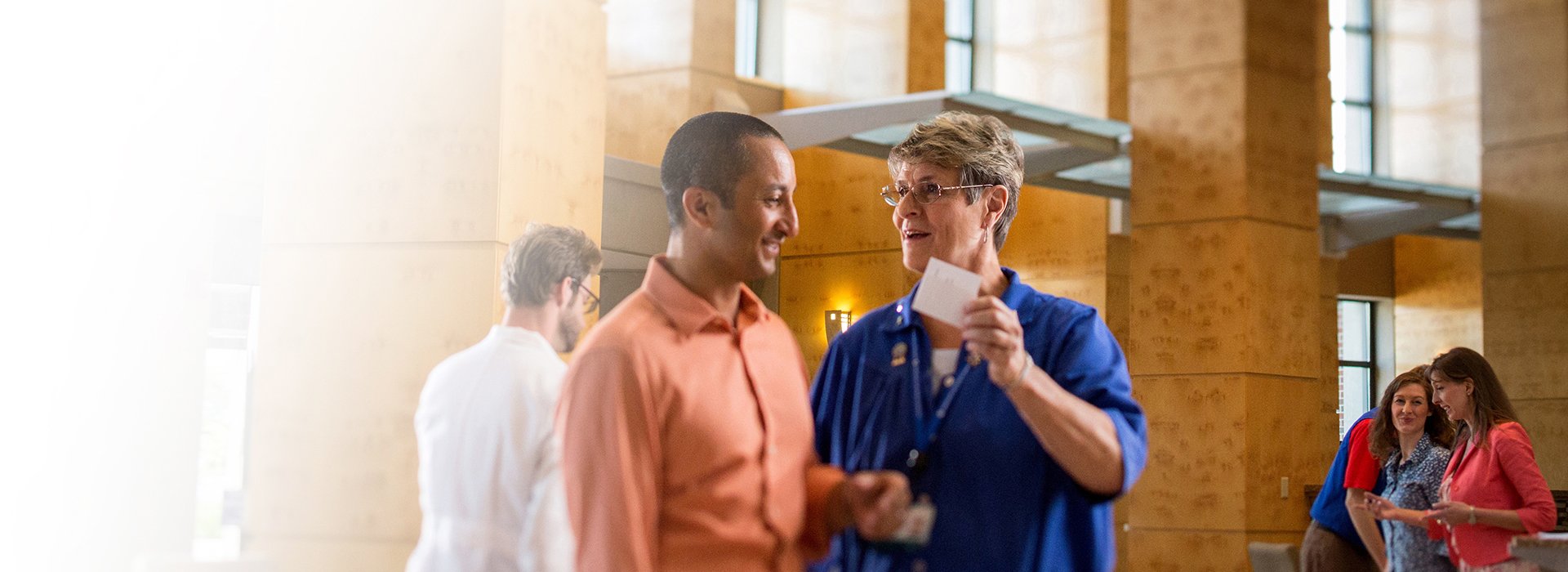 Volunteer in lobby of Waukesha Memorial Hospital.