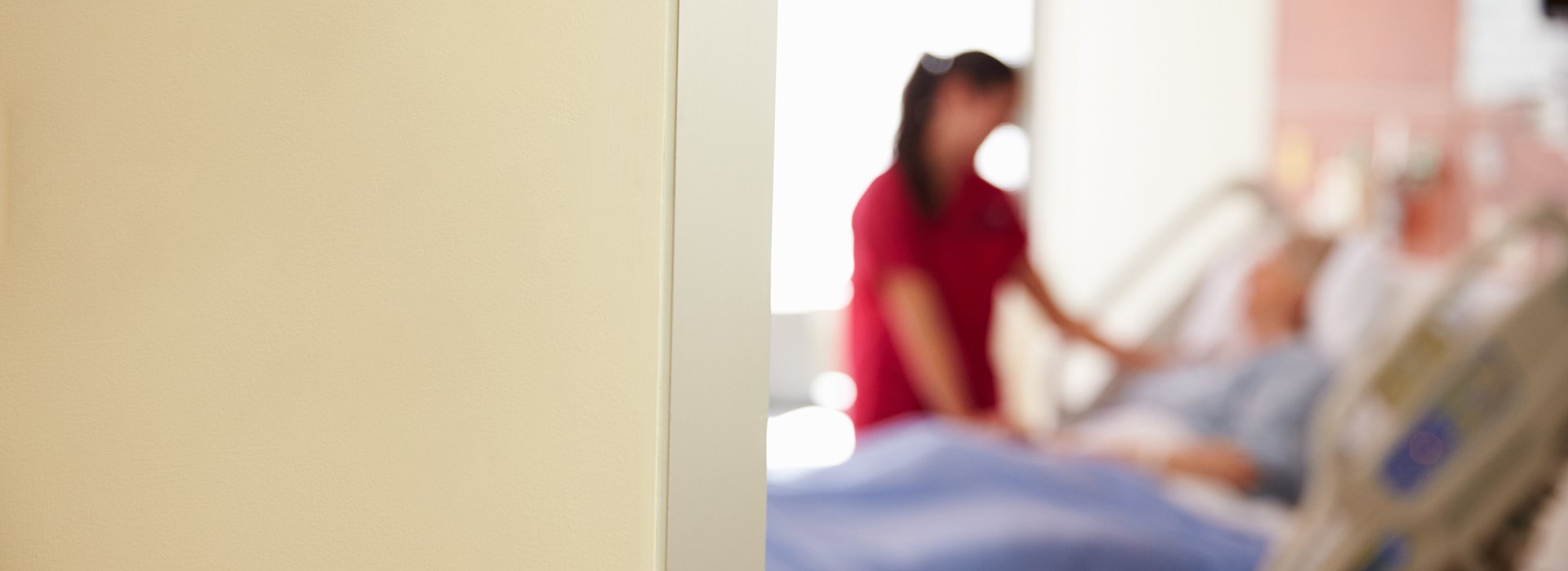 Blurred photo of patient room.