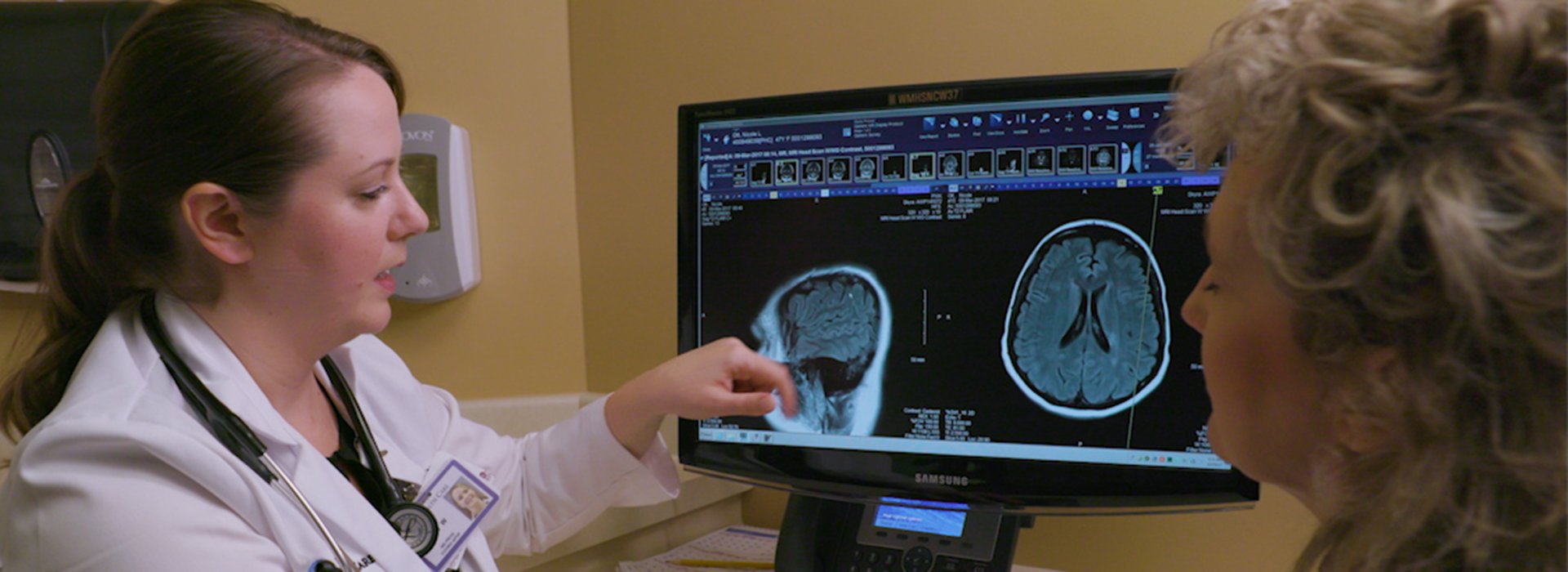 Doctor talking to multiple sclerosis patient.