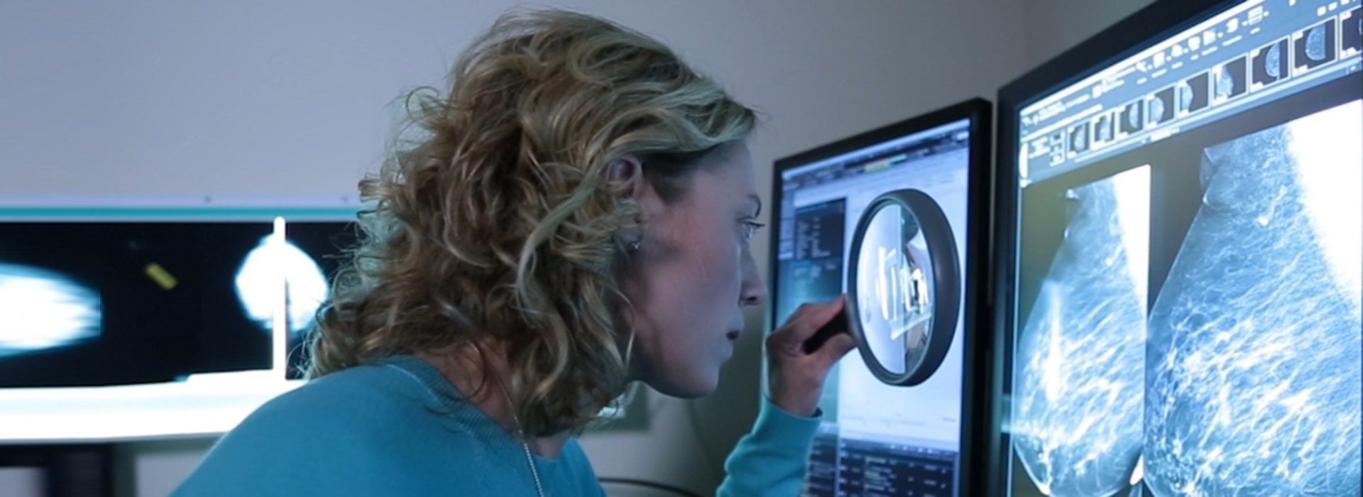 Doctor examining breast cancer scans.