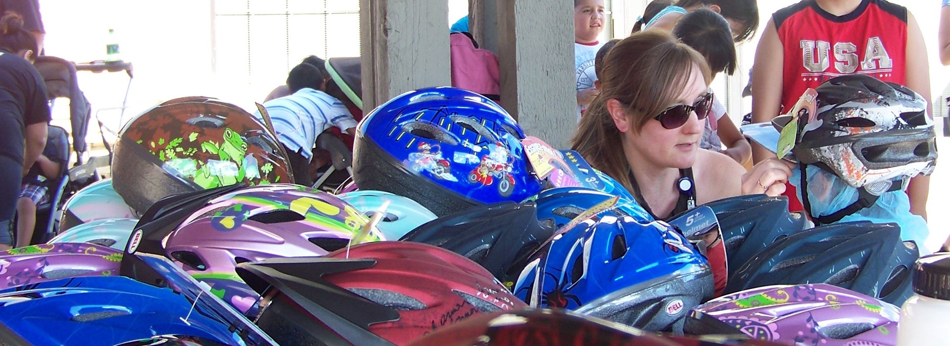 Bike helmets table at event.