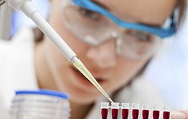 Lab worker performing tests