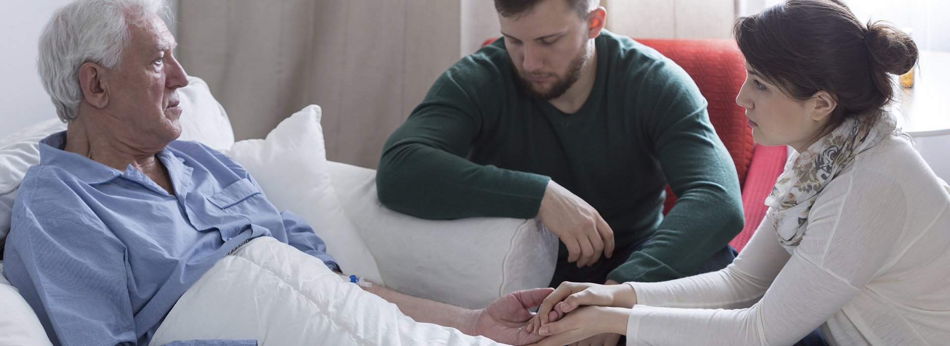 Man in hospice care with family.