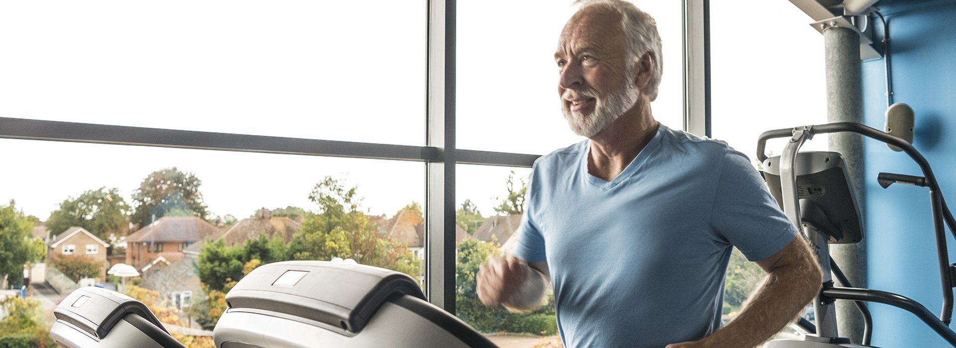 Man running on treadmill in heart rehabilitation program.