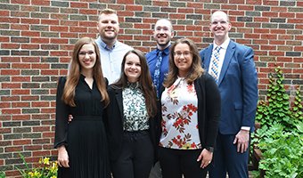 Emily Harwood, DO, Norah Brostowitz, MD, and Laura Horowitz, DO. Back row: Jared Dobbs, MD, Anthony Marchlewski, MD, and Matthew Sullivan-Green, DO.