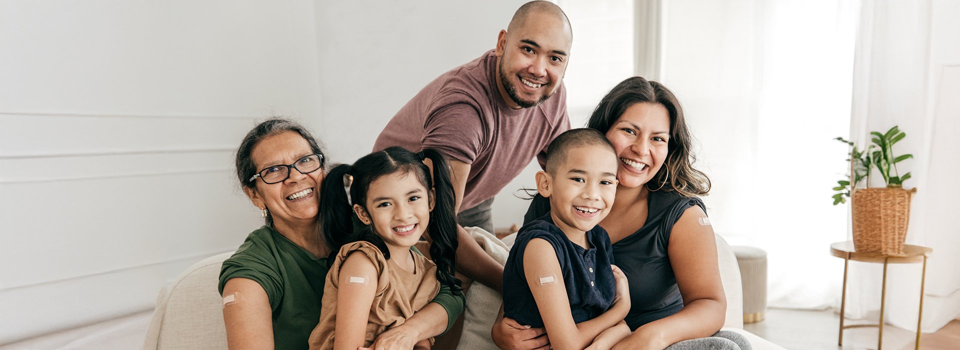 Family with bandages on their arms