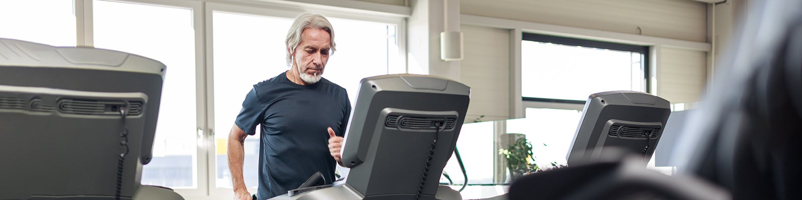 A man walking on a treadmill.